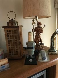 While it looks like a lantern its actually a radio! MAde by Guild! Champion Spark Plug radio is in front of a carved table lamp!