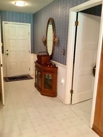 Entrywith basket, mirror, wood items, display cabinet