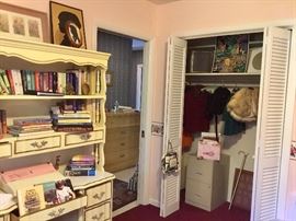 Minks, capes, desk, books