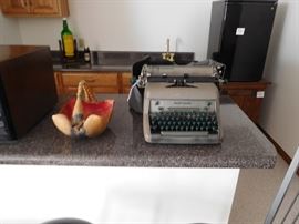 older  typewriter,mini  fridge