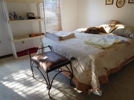 Queen  bed  and  small  bench