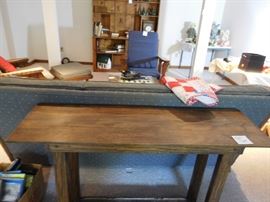 another  view  of  finished  lower  level-sofa,library table.bookcase