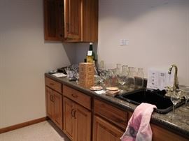 milk  bottles, glassware,  behind  bar  