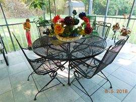 Wrought iron table and four chairs.
