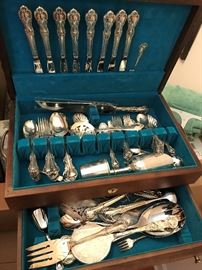 International Sterling Silver Flatware set - Joan of Arc.  60 pieces - 8 soup spoons, 8 dinner forks, 16 spoons, 8 dessert forks, 8 weighted knives, 1 serving spoon, 1 slotted spoon 1 scalloped / slotted spoon, 1 scalloped sugar spoon, 1 cocktail fork, 1 small cocktail fork, 2 piece weighted carving set, 1 butter knife, 1 meat fork, 1 salad set (2 pieces), 1 ladel, 1 large slotted spoon.  Pieces without stainless steel or weighting - 1,814 grams.  Weighted pieces / pieces with stainless steel (knives etc.) 1,542 grams.  $ 1,400.00 for the set and box.