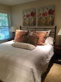 King size bed with bedding.