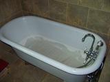 One of a Pair of Cast Iron Claw Foot Bathtubs