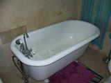 One of a Pair of Cast Iron Claw Foot Bathtubs