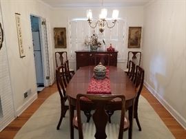beautiful dining room table and chairs. Authentic reproduction Craftique Sideboard.