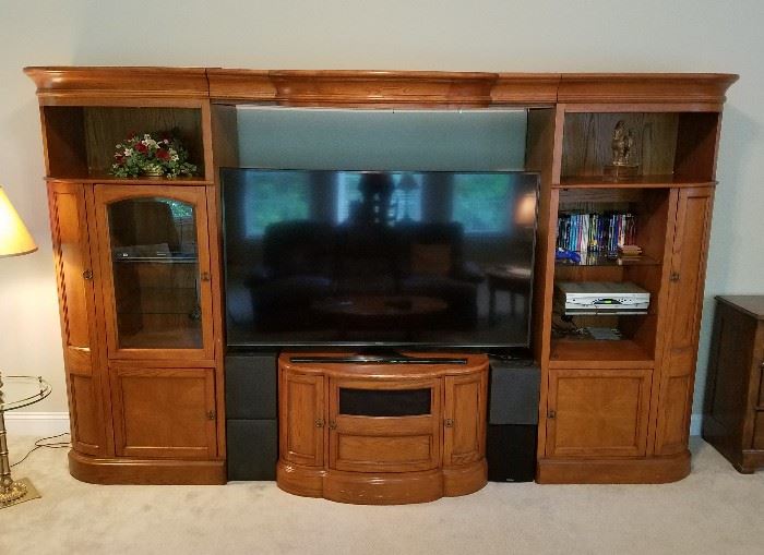 Wall unit is expandable - the top center piece and center shelf (not pictured) both slide narrower/wider as needed (up to approx 70" tv)