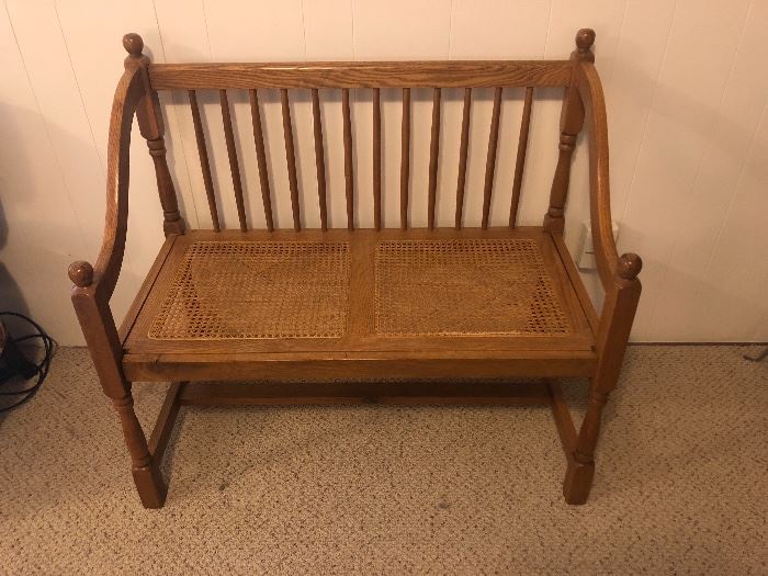 Oak bench with cane seat