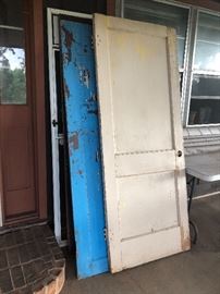 Great mix of old doors with chippy paint