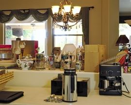 Cappuccino maker and all kinds of kitchen items including lots of assortment of wine related items for sale.