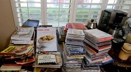 Collection of cook books and other books, cd's, coffee pot, candles, and more.