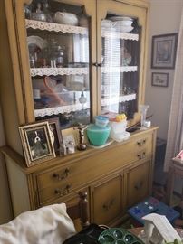 China cabinet full of dishes, more.
