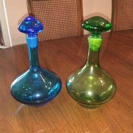 Mid-century handblown decanters with ground stoppers in vibrant colors.