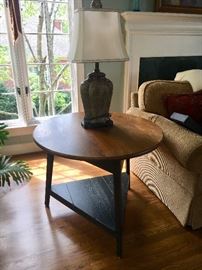 Casual farmhouse style round table—round top and triangle painted base.