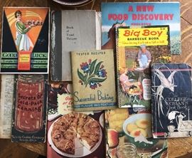 Collection of vintage recipe and canning booklets.