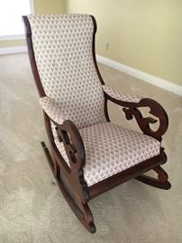 One of three antique rocking chairs.