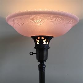 Torche lamp with pink glass shade.