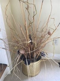 Dried floral in brass planter.