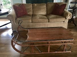 Top quality Henredon down sofa in camel color and Tell City Sleigh Coffee Table.