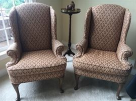 Matching pair wingback Queen Anne chairs.