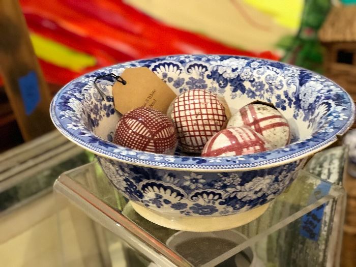 Antique blue and white transfer bowl and red and white lawn balls 