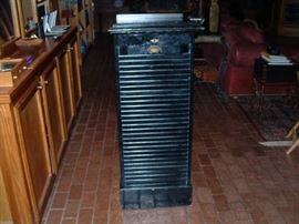 Black "Kosmos" slide lectern, full front showing sliding door which covers multiple removable trays. Original key. You will NOT see another like this.