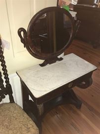 Antique mahogany swan-motif vanity with original mirror and original fitted/carved marble.