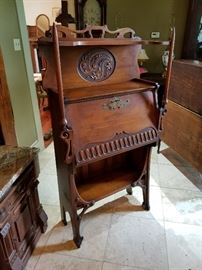 Antique walnut drop-front secretary with intricate hand-carving; Original key -- a one-of-a-kind statement piece!