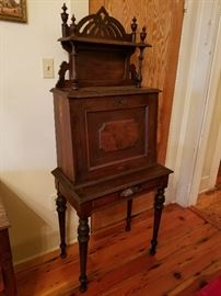 Antique mahogany Wilcox drop-front secretary with intricate Victorian carving. THIS piece can set off a room with any decor.