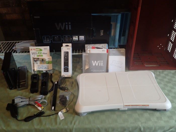 WII GAME WITH LOTS OF CONTROLERS AND STICKS AND BOARD