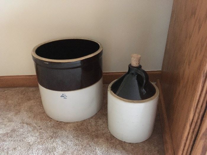 A nice stoneware crock (4 gallon) and a stoneware whiskey drug.