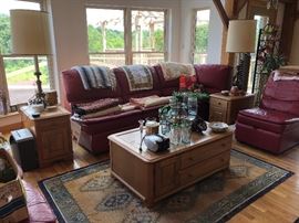 leather sectional sofa, coffee table, end tables, lamps, blankets, rug