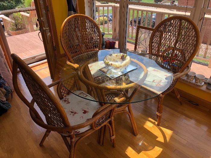 glass top and rattan table and 3 chairs