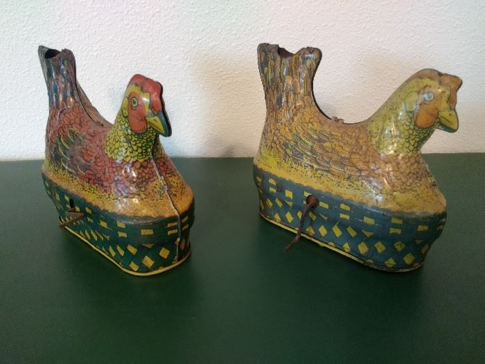 TWO ANTIQUE TIN WIND UP CHICKENS.  BALDWIN MFG. MARBLE INSERT AND WIND UP TO LAY EGGS AND COCK-A-DOODLE-DO