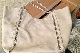 Great leather tote purse has smaller matching purse tucked inside