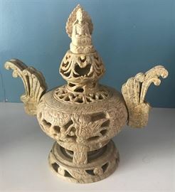 
#2154: Decorative carved urn with elaborate handles
Decorative carved urn from what seems to be natural stone material places on a carved pedestal.

8” H