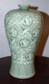 #2175: Celadon Impressive Tall Vase
Celadon Impressive Tall Vase, Handcrafted.

"The voluminous form of this ceramic vase is believed fo be from Korea.

The pattern of the white cranes and clouds is exquisitely inlaid into the surface of the jade-blue body.

11"H