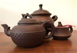 
#2197: Trio Pottery cascading teapots
 A unique collection of three handcrafted pottery teapots. The grouping will make a great display as they are cascading in size and shape.

Small, 2.5"H.
Medium, 3.5"H.
Large, 5.5"H.

Bid per piece, Final bid x 3