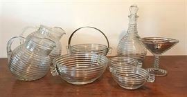 
#2196: Manhattan Collection of Glassware
Manhattan Collection by Anchor Hocking.

Reminiscent of great Art Deco pieces. Great collection to display and to enjoy serving with.