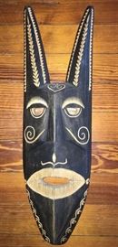 #2371: Attractive Black Wall Mask
Very large- attractive wood carved wall mask. Beautiful hand carving detail. A true showpiece for any wall or collector.

6" x 19”H