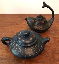 #2199: Pottery teapot pair, handcrafted
 Pottery teapot pair, handcrafted.

Fish, 5"H.
Large, 3.25"H.

Bid per piece, Final bid x 2