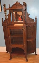 #2237: Fabulous Display cabinet
Fabulous mahogany display cabinet with a glass door, side display shelves and striking carved details.

35" x 12.5" x 58"H