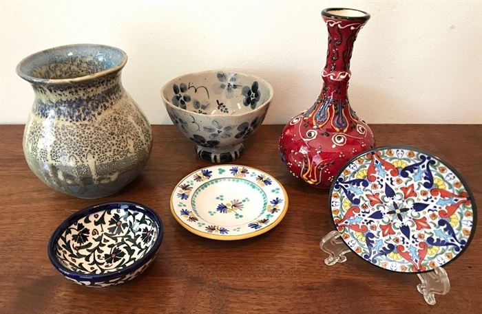 #2232: Collection of handcrafted pottery
Great collection of handcrafted pottery from around the world. Some of the pieces have signatures and initials.

Red vase, 6"H.
Plate , 3"D.
Plate, 4"D.
Bowl, 4.25"D.
Plate, 3.5"D.
Blue Vase, 4.5"H.
