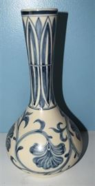 #2161: Porcelain Vase
Blue and white handcrafted perfect shape bud Vase. Turn the single stem of flower into the perfect display with this beautiful original piece.

11"H