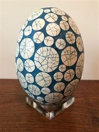 #2205: One of a kind handcrafted porcelain egg with display stand
One of a kind handcrafted porcelain egg and display stand.. The intricate design and the turquoise color create a beautiful pallet.

8"H