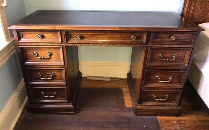 #1406: Leather top Writing desk
Great size writing desk with toiled leather top. Seven drawers for storage amd hanging files.

52" x 24" x 30"H