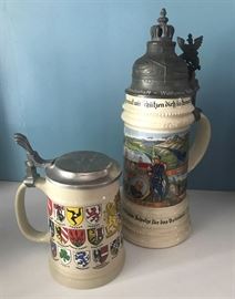#2155: Pair of Steins
To distinctively different drinking Steins. The metalwork and decorative carving and inscriptions make these pieces worth owning.

Large 11"H, Small 5.5"H

Bid per piece, Final bid x 2